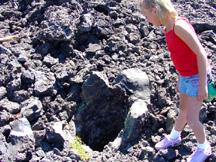 Summer peering into Lava cast mold of a former tree